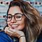 romantic smiling pretty girl in glasses