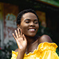 smiling girl raising her hand for greeting